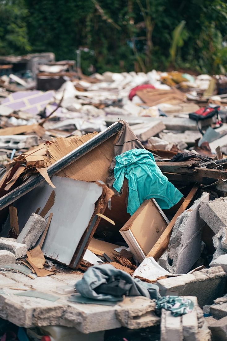 Cluttered site before rubbish removal